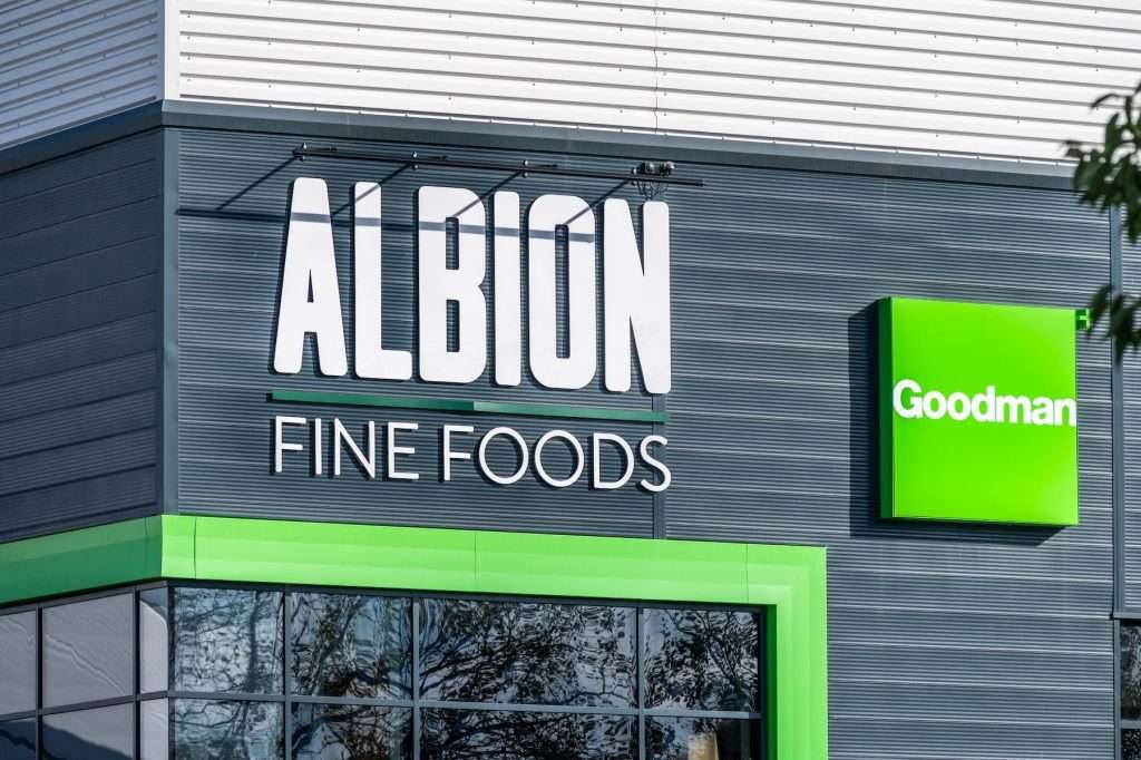 Albion Fine Foods signage on a commercial building, featuring bold white lettering against a dark background, with a green accent and Goodman logo.