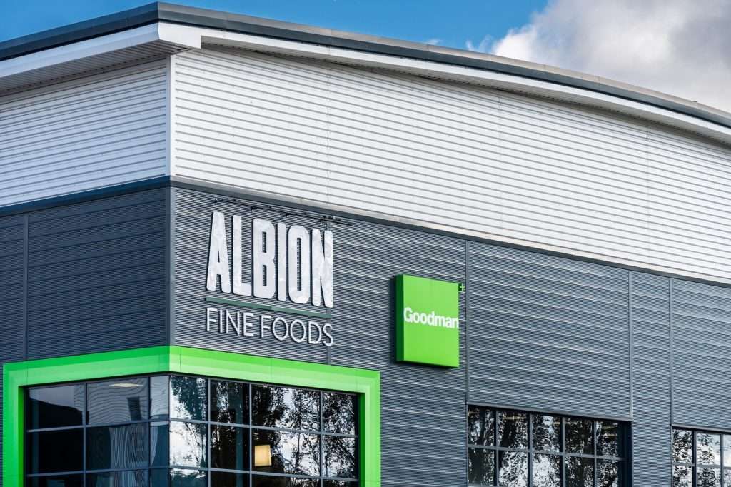 Albion Fine Foods signage on a modern industrial building, featuring a green accent and Goodman logo, reflecting commercial property photography in Reading, Berkshire.
