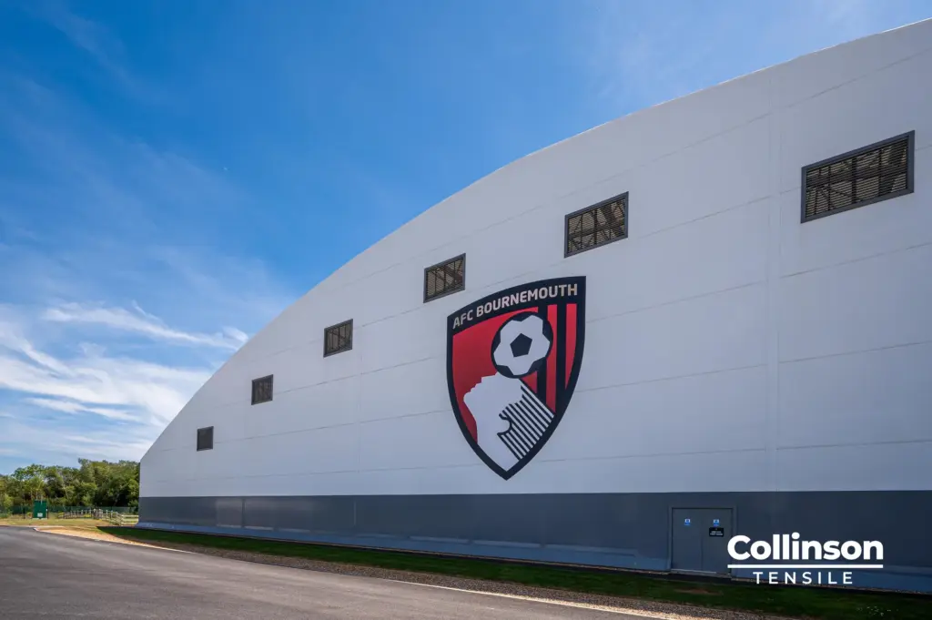 Collinson Tensile AFC Bournemouth Training Facility Crest Detail - Duncan MacBrayne AFC Bournemouth crest on the tensile membrane facade of the indoor training facility by Collinson Tensile