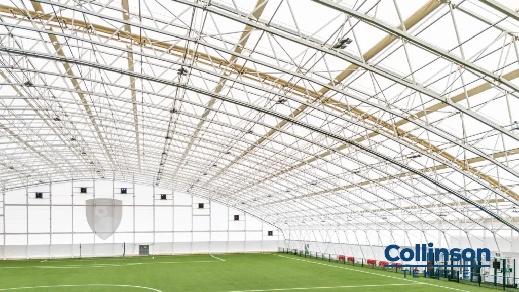 Collinson Tensile AFC Bournemouth Training Facility Interior Wide View - Duncan MacBrayne Wide interior view of the clear-span steel structure and translucent membrane roof, AFC Bournemouth indoor facility
